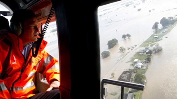 NSW Premier nathan Rees looks over the Macleay River and the flooded towns of Smithtown and Gladstone.