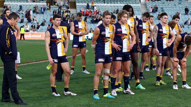 Coach of the Eagles John Worsfold and his players look on during post game presentations after being defeated by Sydney Swans at Patersons Stadium.