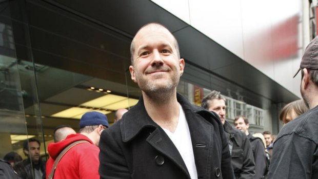 In this April 3, 2010 file photo, Jonathan Ive, Apple senior vice president of industrial design, smiles as he leaves an Apple store on the first day of Apple iPad sales in San Francisco.