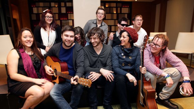 Gotye and Monique Brumby (front row,  third and fourth from left) with people from Aardvark, celebrate funding from the government.