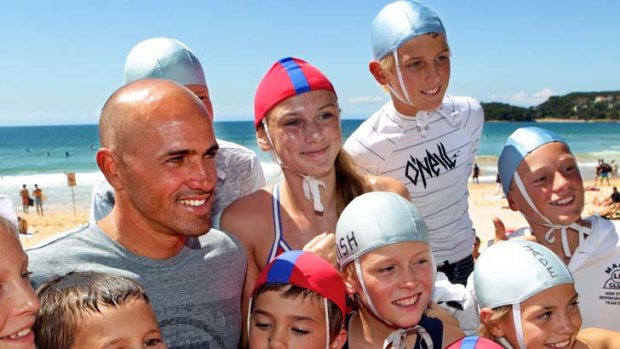 King of the nippers &#8230; superstar Kelly Slater with young admirers at the opening of the Manly-Freshwater world surfing reserve.