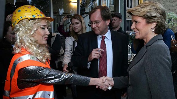 Climate activists greet Deputy Opposition Leader Julie Bishop during her visit to Trinity College.