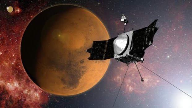 In this artist concept provided by NASA, the MAVEN spacecraft approaches Mars on a mission to study its upper atmosphere. 