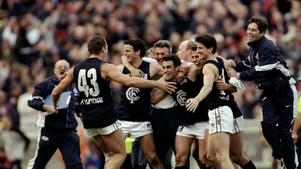Carlton players celebrate after the final siren in their 1999 preliminary final win over Essendon.