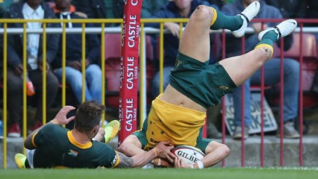 The headless wingman: Adam Ashley-Cooper scores the Wallabies' only try.