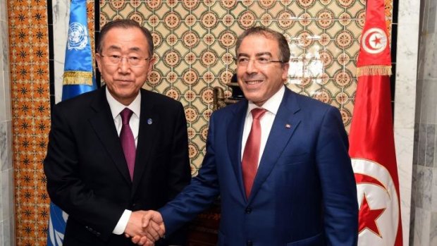 Tunisian Foreign Affairs minister Mongi Hamdi (right) greets United Nations Secretary General Ban Ki Moon before their meeting in Tunis on Saturday, October 10, 2014. 