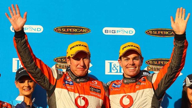 All smiles: Mark Skaife and Craig Lowndes celebrate their win yesterday at Phillip Island.