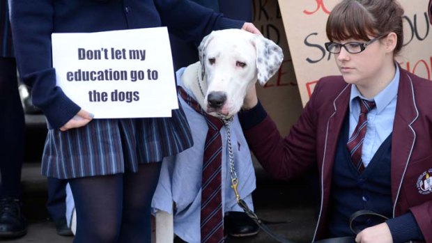 Mowbray College students on the steps of Parliament House protest against the closure of their school, which was placed into voluntary administration last week.