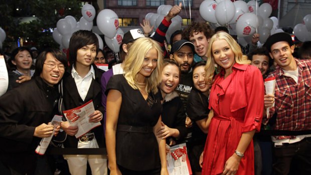Partners of Australia's cricket team leaders, Lara Bingle (left, in black) and Rianna Ponting, were first through the doors for David Jones' Boxing Day sale yesterday.