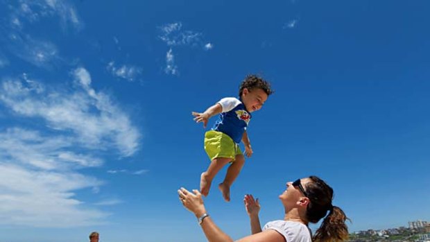 Maria Stephenson, of Bondi, has fun at Bondi Beach with with her two-year-old son Zachariah.