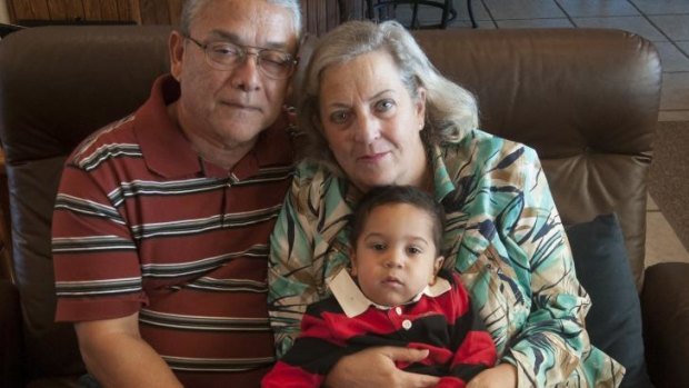Lynne and Ernest Machado, parents of Marlise Munoz, who has been brain dead and on life support for more than a month, with their grandson and Munoz's son, Mateo, 15 months, in Fort Worth, Texas.