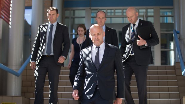 Detectives who arrested Mr Spedding leave Port Macquarie court on Thursday.