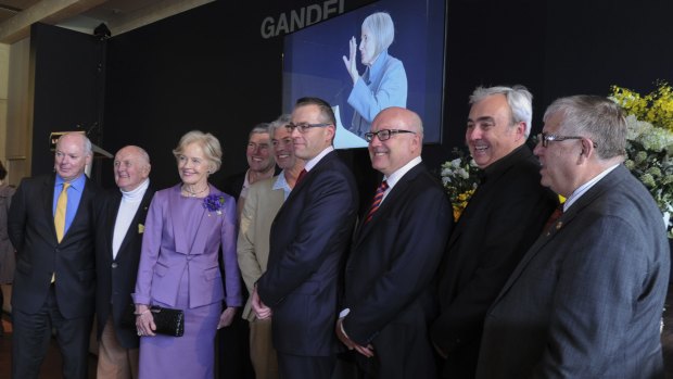 Celebrating the life of Betty Churcher at the National Gallery of Australia. From left, Gerard Vaughan, John Olsen, Dame Quentin Bryce, Ben, Paul and Tim Churcher, Senator George Brandis, Peter Churcher and Alan Dodge.
