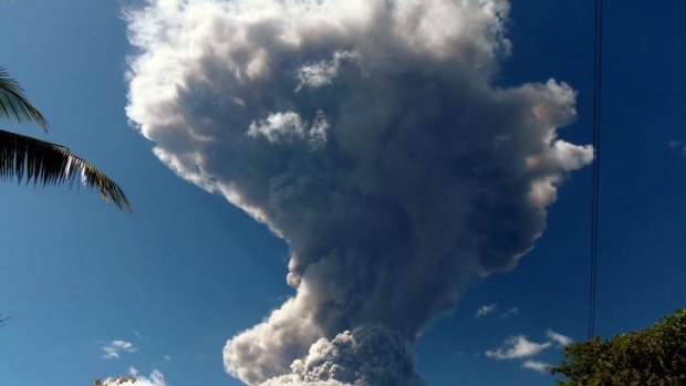 View of the Chaparrastique volcano spewing ashes and smoke.