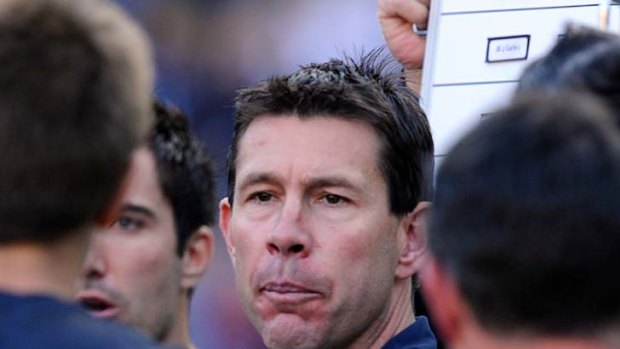 Final words: With Essendon up by a point at the end of the third quarter, after leading at every break, Carlton coach Brett Ratten gives his instructions.