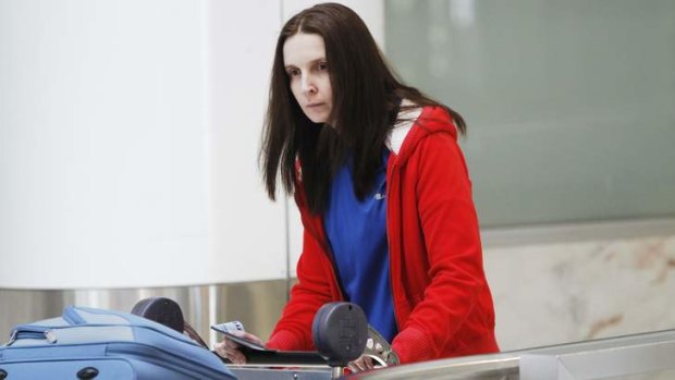 Back in Sydney: Allyson McConnell looked ashen-faced as she walked through the airport.