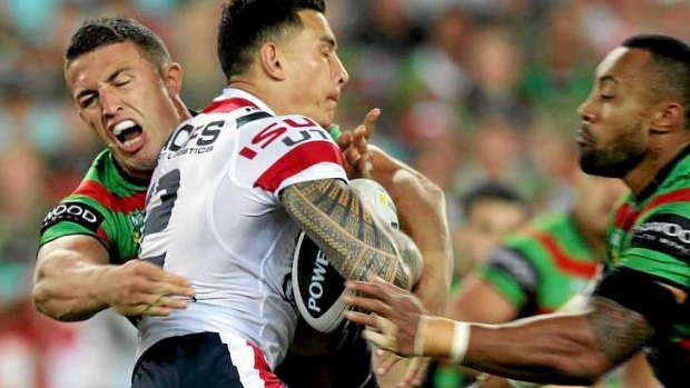 Clash of the titans: Sonny Bill Williams charges into Sam Burgess.