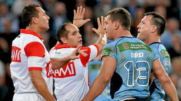 Disbelief: Greg Bird of NSW argues with referees Shayne Hayne (L) and Ashley Klein after being sin binned for fighting.