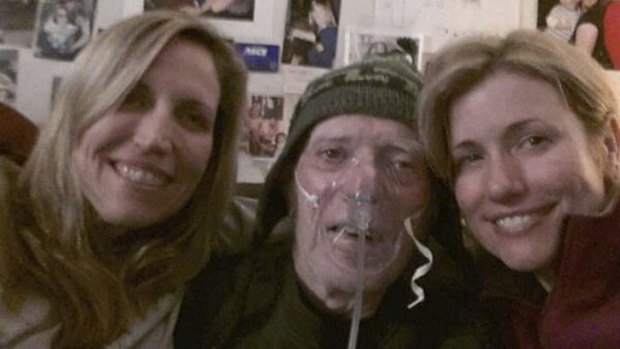 Laurie Kilmartin (left) with her father and sister.