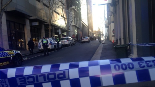 Police have cordoned off Little Bourke Street as they examine the scene.
