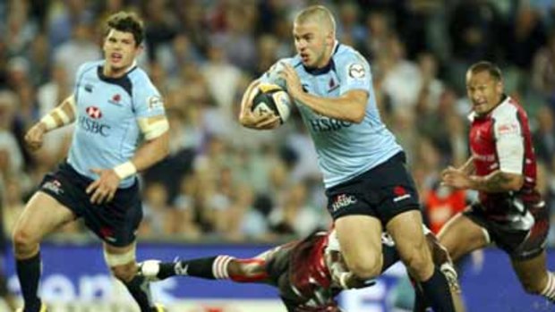 Settled ... former Reds and Force flyer Drew Mitchell is enjoying his time in Sydney with the Waratahs. Entering last night’s match against the Crusaders he was leading the tryscorers’ ladder with six.