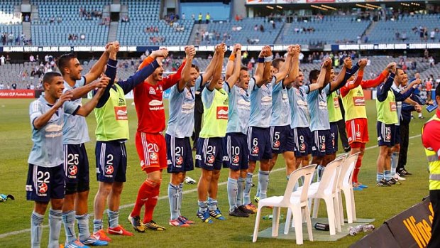 Sydney FC players acknowledge their fans after hammering Melbourne Victory 5-0 at Etihad Stadium on Sunday.