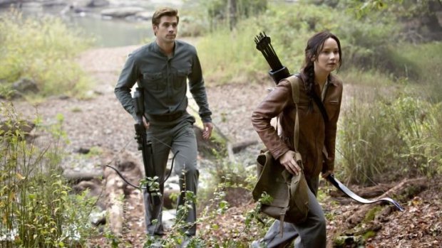 Back to the woods: Liam Hemsworth and Jennifer Lawrence in the latest instalment of <i>The Hunger Games</i>.