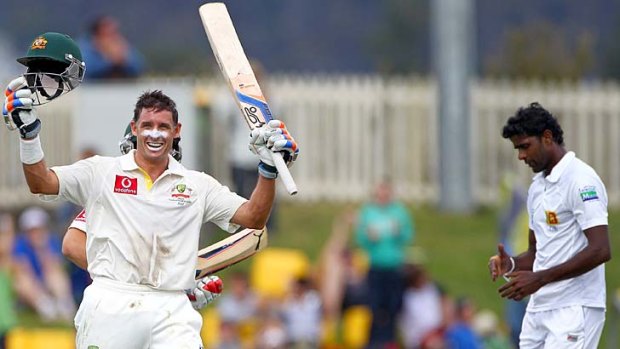 That's 100 &#8230; Michael Hussey marks the moment.