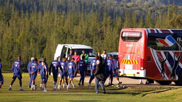 France's national football team, including Franck RIbery, return to their bus after refusing to take part in a training session in Knysna, near Cape Town during the 2010 World Cup.