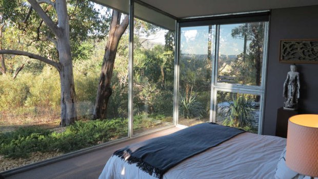 Remote bliss: the bedroom opens onto the property's secluded grounds.