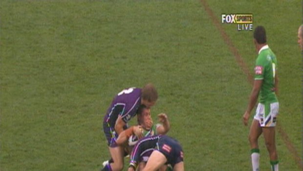 A Fox Sports screengrab of a Melbourne Storm chin strap tackle.