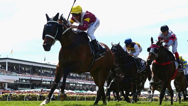 Lively and hopeful: Nash Rawiller riding Kelinni crosses the line to win the Lexus Stakes.