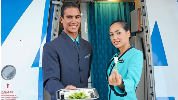 AIr Tahiti Nui crew offer a warm welcome aboard.