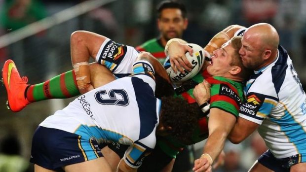 Rabbit sigh: George Burgess is upended by Luke Bailey and Beau Falloon.