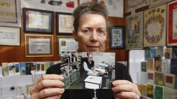 "There’s no point [being] hysterical"' ... Karen Short, wife of Australian missionary John Short, poses with a photo of her husband inside the Christian Book Room in Hong Kong.