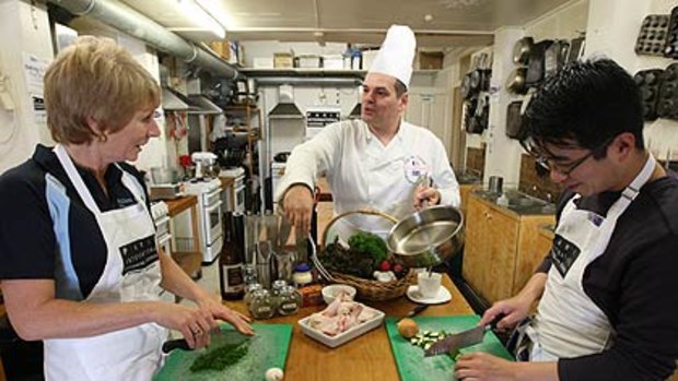 I feel like truffles tonight ...  students Sharon Smith and Antony Chen whip up a storm under the watchful eye of chef and teacher Laurent Villoing.