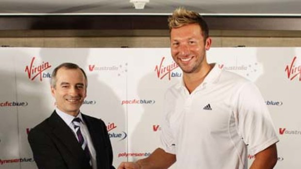 Ian Thorpe with John Borghetti, chief executive of Virgin Blue, at yesterday's comeback announcement.