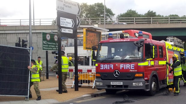 The scene of a road incident involving a media transport bus and cyclist on the road to the ExCel Arena.