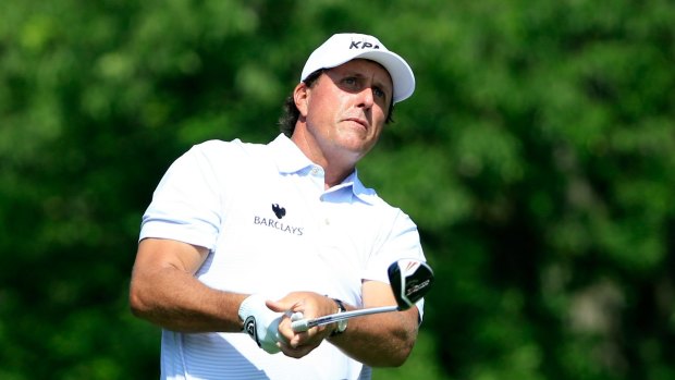 Phil Mickelson said he reached an agreement with the market regulator to return proceeds of nearly $US1 million ($1.4 million) from the trades. 