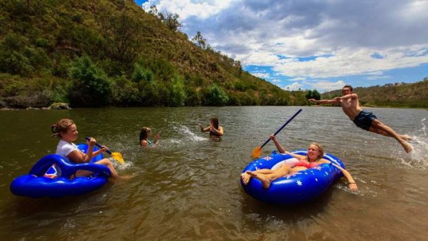 From Royalla (from left) Phoebe Thompson 11, Sarah Thompson,  Hannah Ferguson, Bree Sturdess and Sam Quirke, all aged 17, of Calwell, cooling off in the Murrumbidgee River.