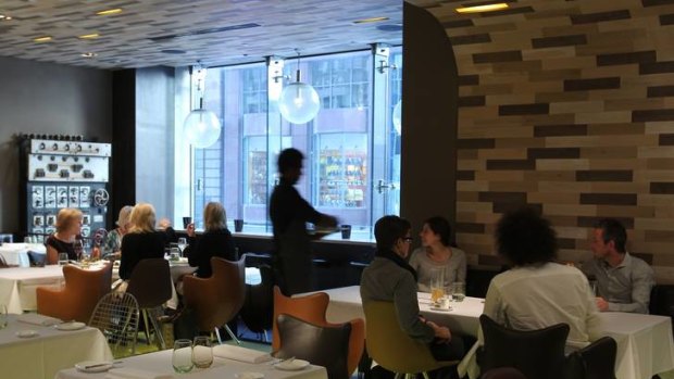 Statement ... the fashionable dining space has glass floors and parquetry walls.