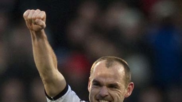 Fulham's Danny Murphy celebrates after scoring a penalty against Tottenham.