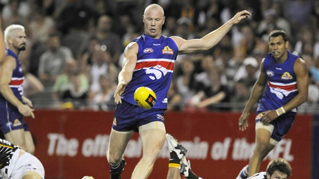 Barry Hall leaves the Hawks in his wake as he snaps for goal last night.