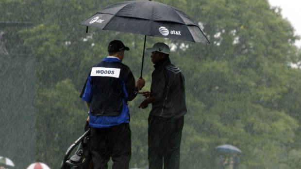 Tiger Woods in the heavy rain during the US Open Golf Championship.
