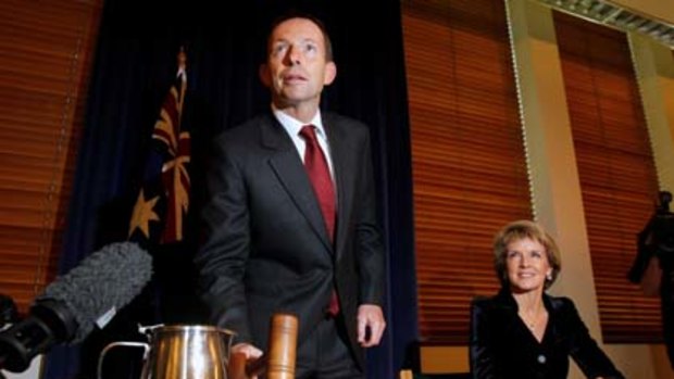 Opposition Leader Tony Abbott calls the Liberal Party room meeting to order.