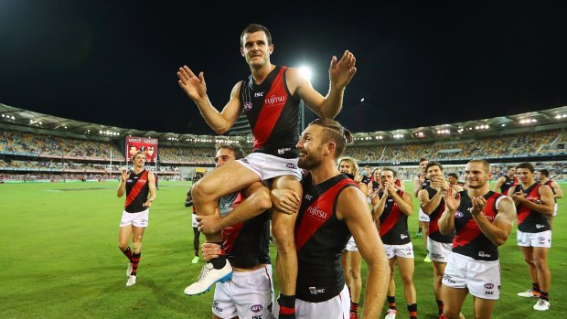 Brent Stanton is chaired from the field after a win in his 250th match.
