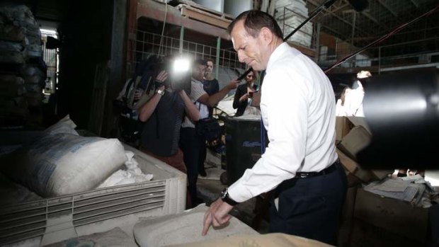 Opposition Leader Tony Abbott during his visit to a home insulation business in Brisbane, on Friday August 9.