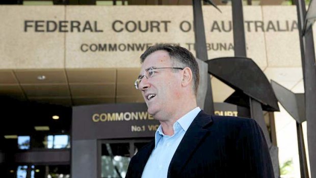 Norm Carey leaving the Federal court in 2010 after ASIC reported they would return his passport.