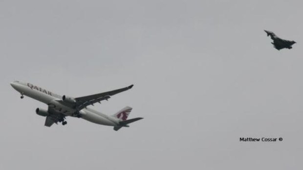 The Royal Air Force jet escorting the passenger plane to Manchester Airport. 
