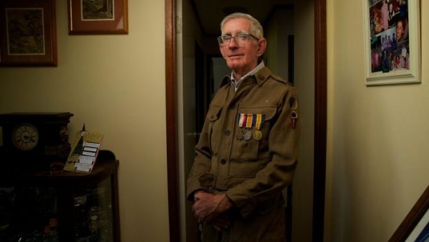 Tony Pickrell, 77, son of Maurice John Pickrell who fought in WWI, with his father's service uniform.